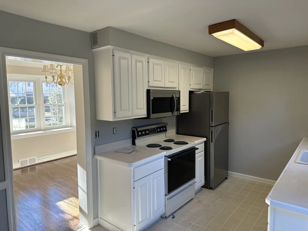 Cabinet refinishing in Havertown, PA showing modern white kitchen update